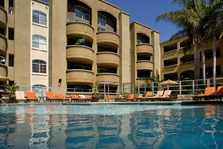 Apartment building with a pool managed by a property management company