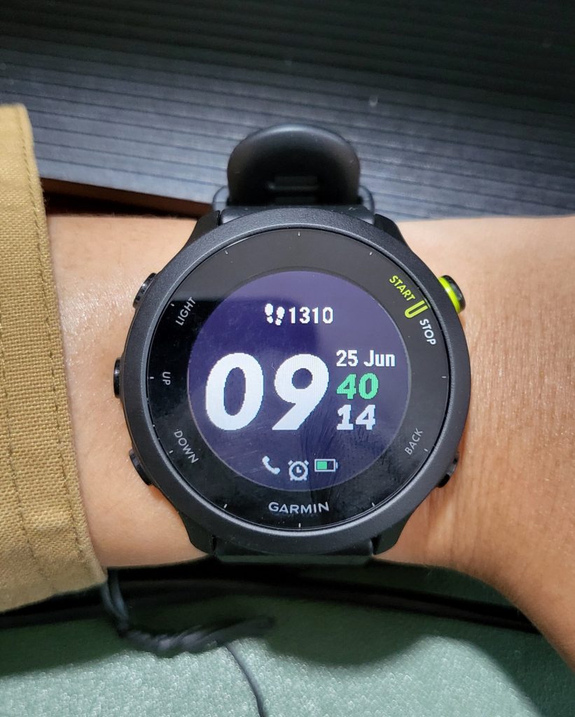 Garmin Forerunner 55 smartwatch on a wrist — AI wearables 2026