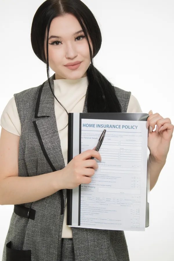 Insurance agent presenting a home insurance policy to a client