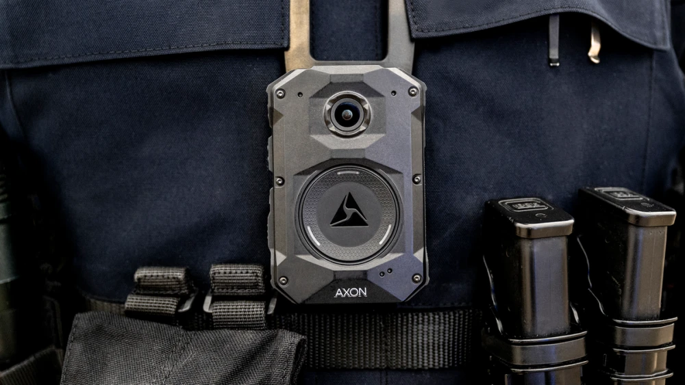 An Axon body-worn camera — Lakeland's $21.9 million contract includes Axon Draft One, which writes police reports from body-camera audio