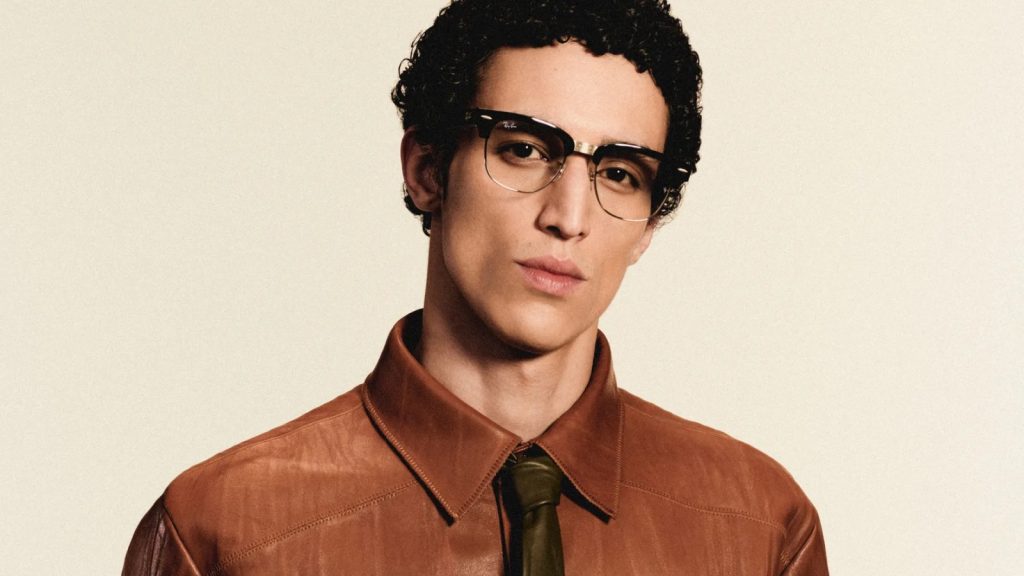 Model wearing Ray-Ban Meta Audio smart glasses in black Clubmaster style