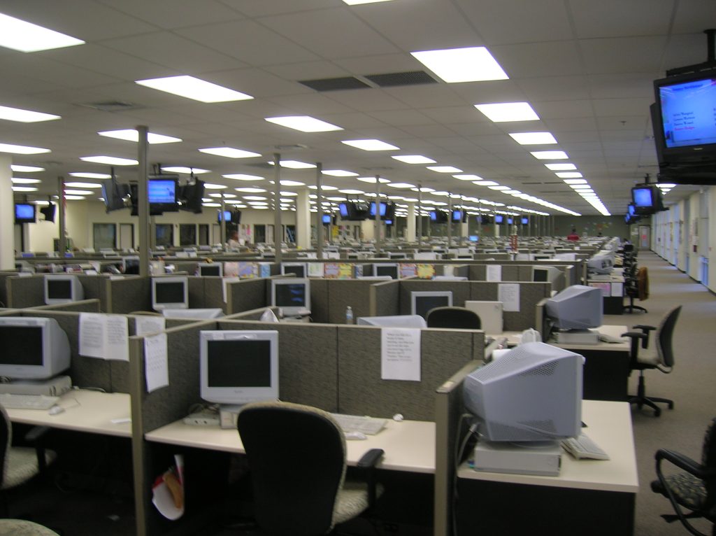 Sales team working in a large call center office