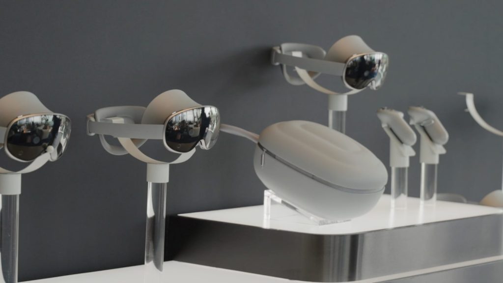Samsung Galaxy XR headsets on display stands with travel case and controllers