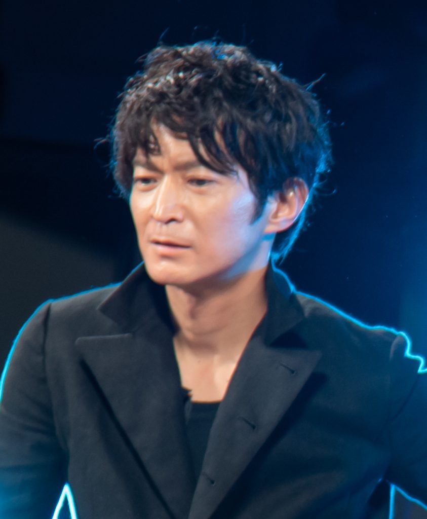 Kenjiro Tsuda — the anime voice actor whose case prompted the Tokyo District Court's first-ever ruling recognizing voice protection under publicity rights. Photo: KniBaron / Wikimedia Commons, CC BY 2.0.