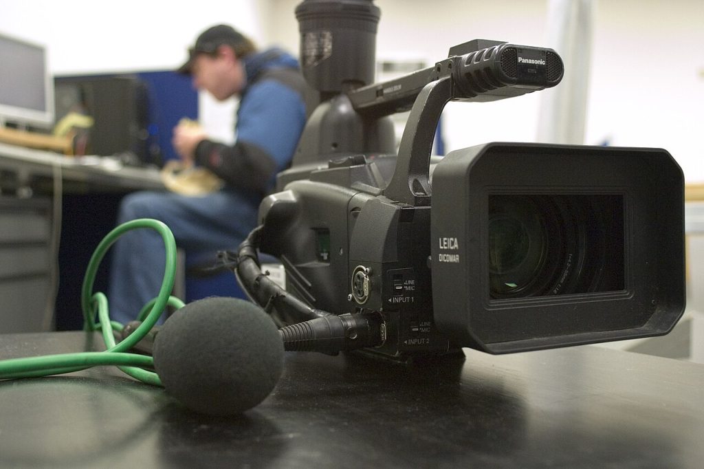 Professional video camera and microphone used by a YouTube creator